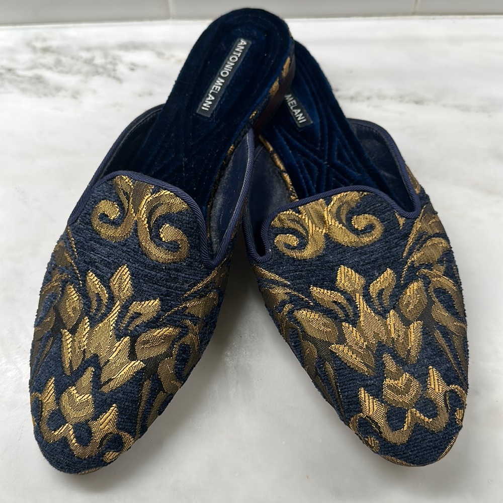 Antonio Melani slip on navy and gold shoes.